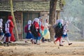 Young girls are walking together to attend the village school