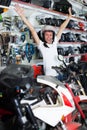 Young glad man sitting on the bike in helmet