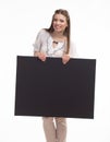 Young glad woman showing presentation, pointing on placard