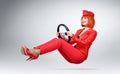 Young glamor girl in red driver car with a wheel Royalty Free Stock Photo