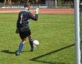 Young goalkeeper with a ball