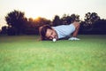 Golfer checking line of putt on green Royalty Free Stock Photo