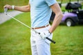 Young golfer holding golf club Royalty Free Stock Photo