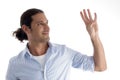 Young good looking man with counting fingers Royalty Free Stock Photo
