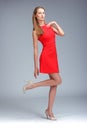 Young gorgeous caucasian blonde in red dress posing Royalty Free Stock Photo