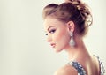 Young gorgeous girl dressed in evening gown and delicate makeup on. Royalty Free Stock Photo