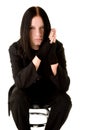 Young goth sitting on a bar chair Royalty Free Stock Photo