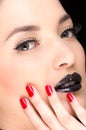 Young gothic beautiful woman with red nails