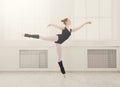 Beautiful ballerina stands in ballet arabesque Royalty Free Stock Photo