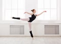 Beautiful ballerina stands in ballet arabesque Royalty Free Stock Photo