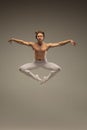 Young and graceful ballet dancer isolated on studio background. Art, motion, action, flexibility, inspiration concept.