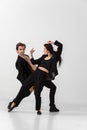 Young and graceful ballet dancers in minimal black style isolated on white studio background Royalty Free Stock Photo