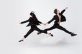 Young and graceful ballet dancers in minimal black style isolated on white studio background Royalty Free Stock Photo