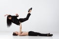 Young and graceful ballet dancers in minimal black style isolated on white studio background