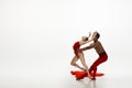 Young graceful couple of ballet dancers dancing on white studio background Royalty Free Stock Photo