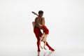 Young graceful couple of ballet dancers dancing on white studio background Royalty Free Stock Photo