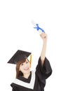 Young graduate girl student holding diploma and hand up