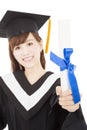 Young graduate girl student holding and showing diploma Royalty Free Stock Photo