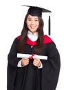 Young graduate girl student holding and showing diploma Royalty Free Stock Photo