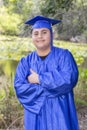 Young Graduate Posing With Cap And Gown With Thumb`s Up