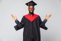 Young graduated african american man over isolated on white background crazy and mad shouting and yelling with aggressive Royalty Free Stock Photo