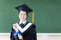 Young graduation student in her classroom