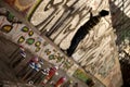 Young graffiti artist sprays picture on the wall