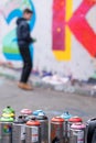 Young graffiti artist at work blurred, Leake Street tunnel. Waterloo, London UK. Royalty Free Stock Photo