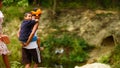 A Young grand father holding his cute child on shoulders. Family spending time together.Happy Grandfather's day