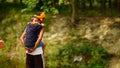 image of father holding his cute child on shoulders. Family spending time together.Happy father's day