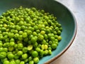 green peas, plate with hot cooked peas, garden harvest, summer vegetables Royalty Free Stock Photo