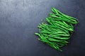 Young green or string beans on black stone table top view. Organic vegetarian food. Royalty Free Stock Photo