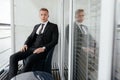 Young groom sitting on the balcony