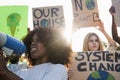 Young group of demonstrators on road from different culture and race protest for climate change - Focus on african girl face