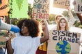 Young group of demonstrators on road from different culture and race protest for climate change - Focus on right girl face