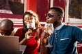 Young group of friends drinking a glass of red wine Royalty Free Stock Photo