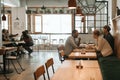 Young group of friends having lunch together in a bistro Royalty Free Stock Photo