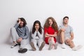 Young group of friends in a studio, stand out from the crowd concept. Royalty Free Stock Photo