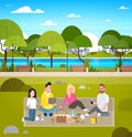 Young Group Of Friends Weekend Picnic In Park People Outdoors Sitting On Grass Relaxing Royalty Free Stock Photo