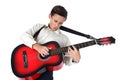 Young guitar player performing very passionately on a white back