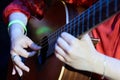 Young guitarist absorbs in her craft Royalty Free Stock Photo