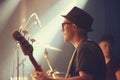 A young guitarist performing on stage. This concert was created for the sole purpose of this photo shoot, featuring 300 Royalty Free Stock Photo