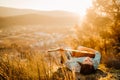 Young guitarist playing acoustic guitar and enoying the sunset.Learning to play an instrument.Singer-songwriter in nature Royalty Free Stock Photo