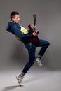 Young guitarist plays on the electric guitar