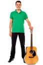 Young guitarist standing with guitar Royalty Free Stock Photo