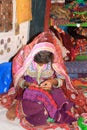 Gujarati girl embroidering her trousseau