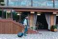 Young Guy Arab Businessman Student Came go to Restaurant With Suitcase in Hand, Smiling at Camera, Stops and Looks Away. Royalty Free Stock Photo