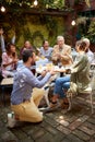 A young guy asks his girlfriend to marry him at wonderful party in a bar with friends. Leisure, bar, outdoor, friendship