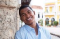 Young guy in a blue shirt in a colonial town