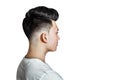 Young guy brunette with pompadour volume haircut 50s - 60s. real photo retro hair style side, for barbershop, isolated Royalty Free Stock Photo